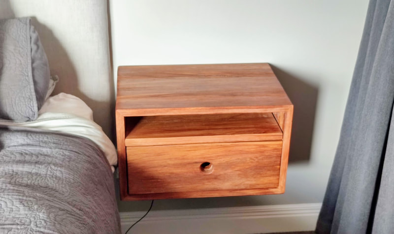 Hanging bedside cabinets in rimu